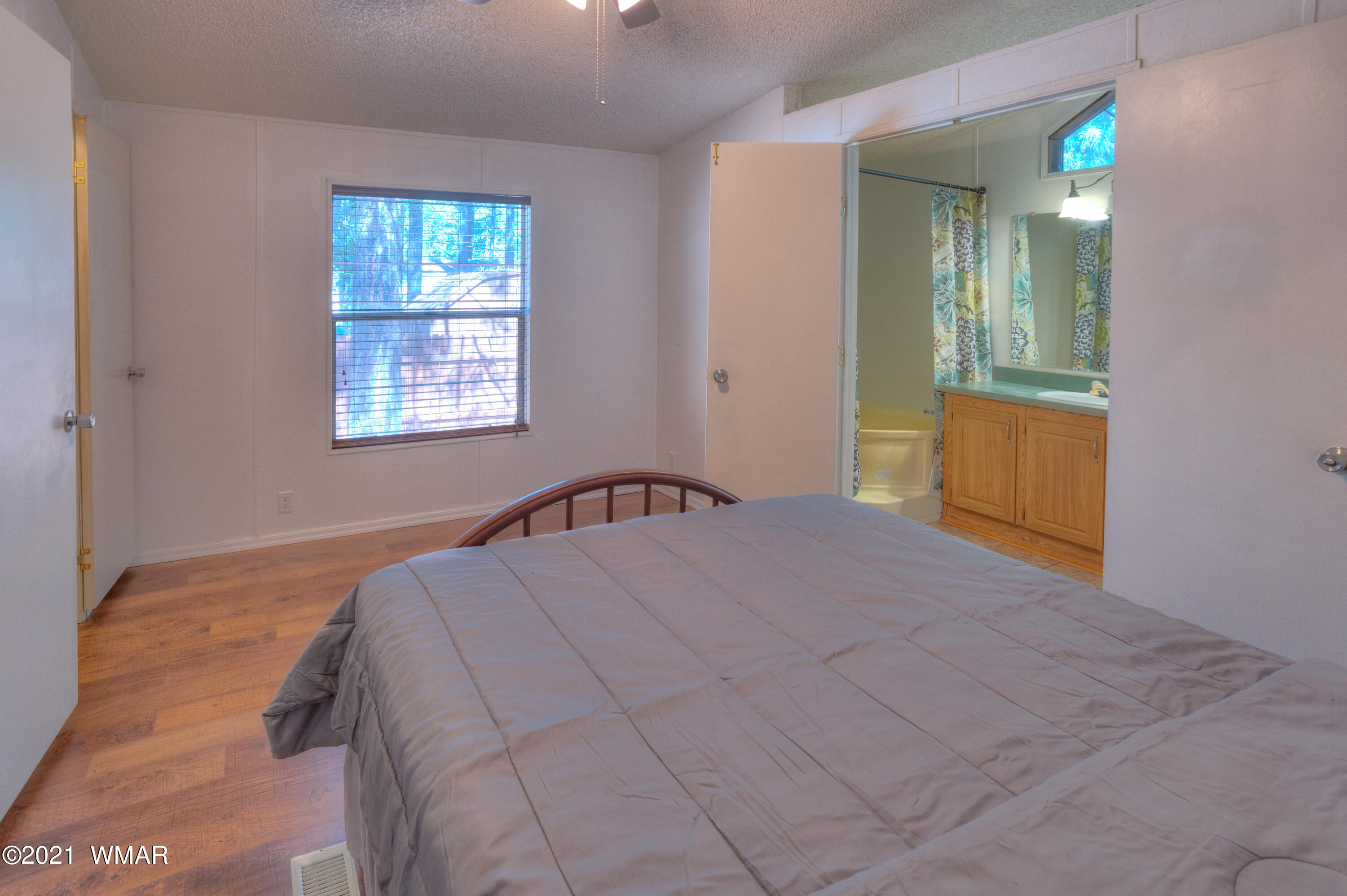 5232 South Blue Ridge Loop Pinetop, AZ 85935 - Photo 11 of 18 a bedroom with a bed and a window