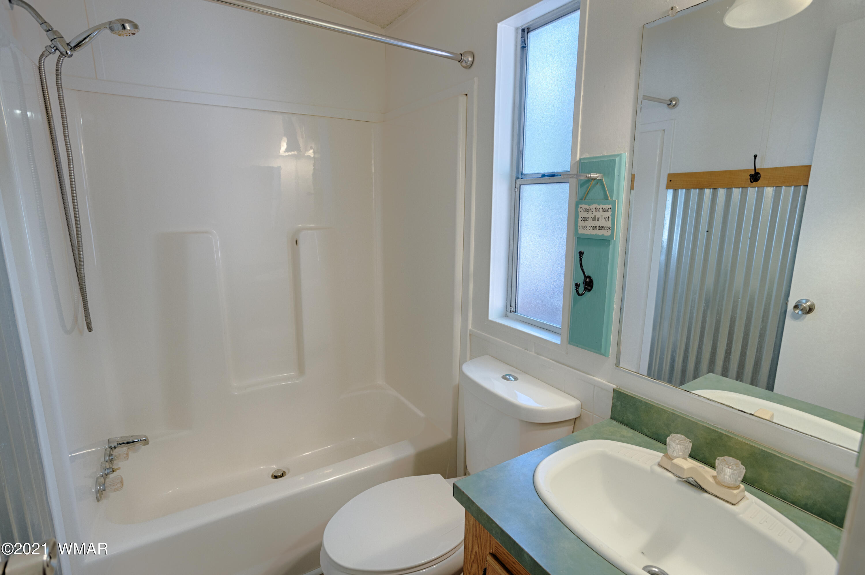 5232 South Blue Ridge Loop Pinetop, AZ 85935 - Photo 15 of 18 a bathroom with a sink toilet and shower