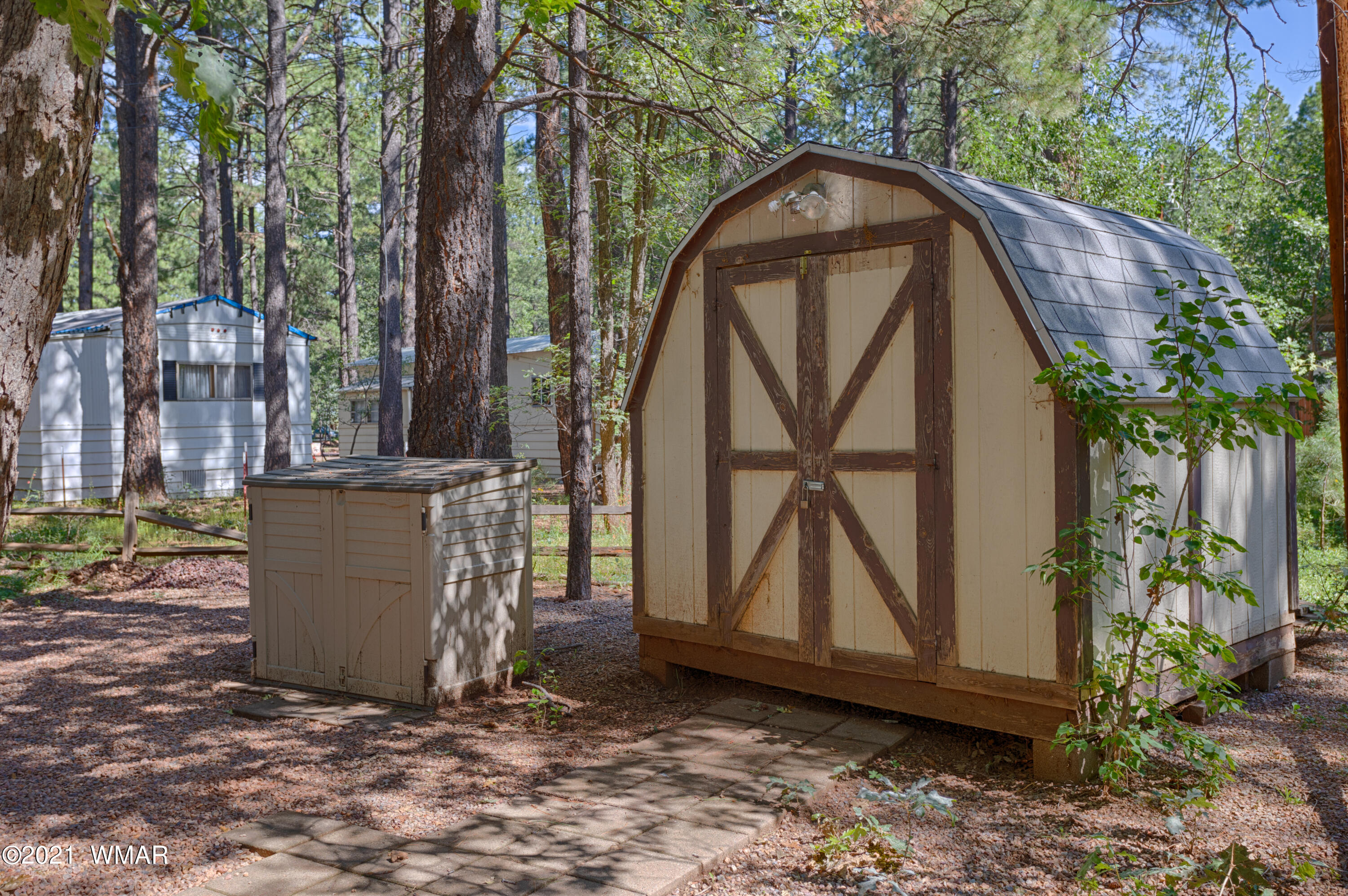 5232 South Blue Ridge Loop Pinetop, AZ 85935 - Photo 18 of 18 a view of backyard with a barn and a cactus plant