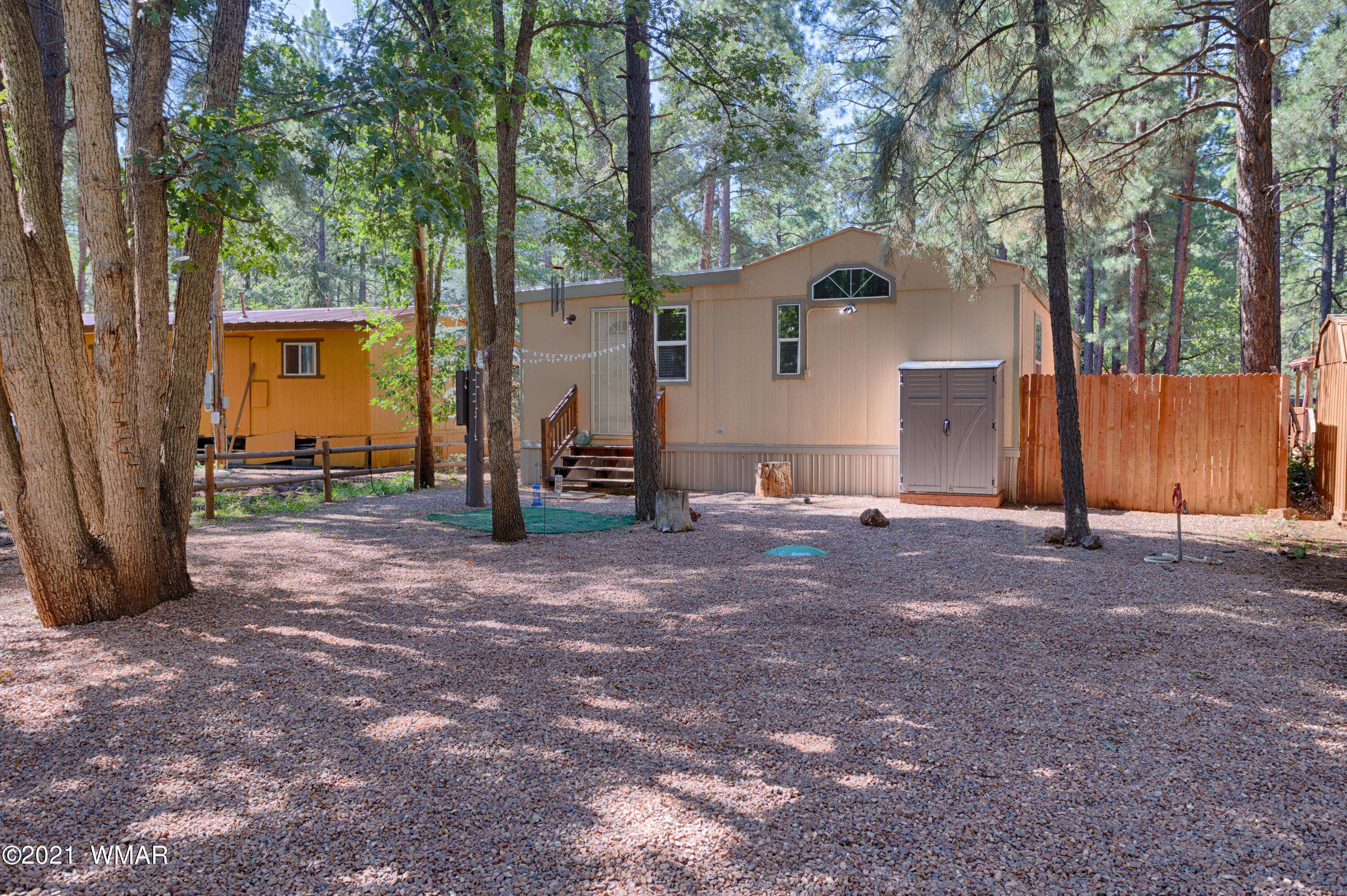 5232 South Blue Ridge Loop Pinetop, AZ 85935 - Photo 3 of 18 a view of a house with backyard and trees
