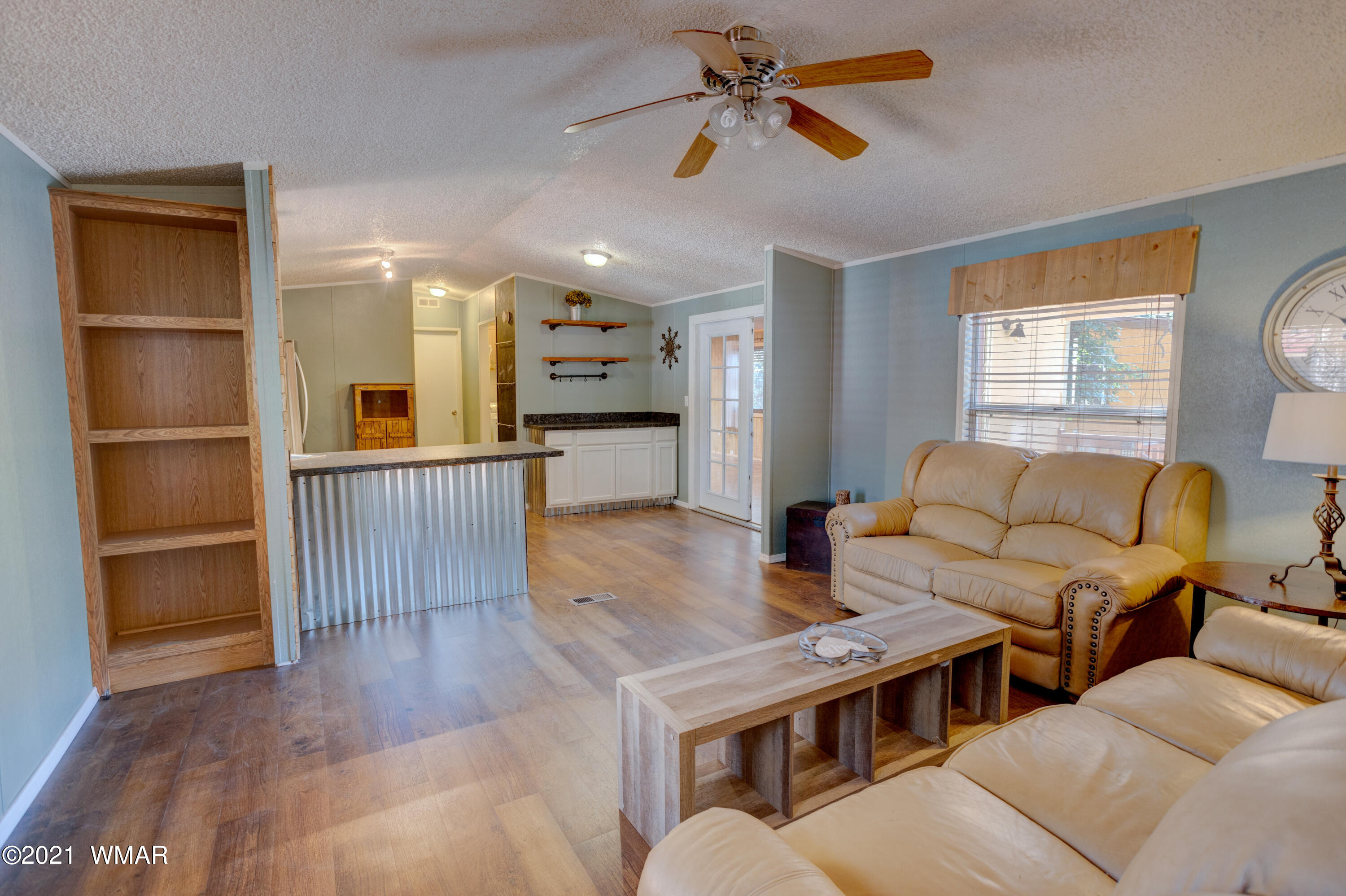 5232 South Blue Ridge Loop Pinetop, AZ 85935 - Photo 7 of 18 a living room with furniture and a wooden floor