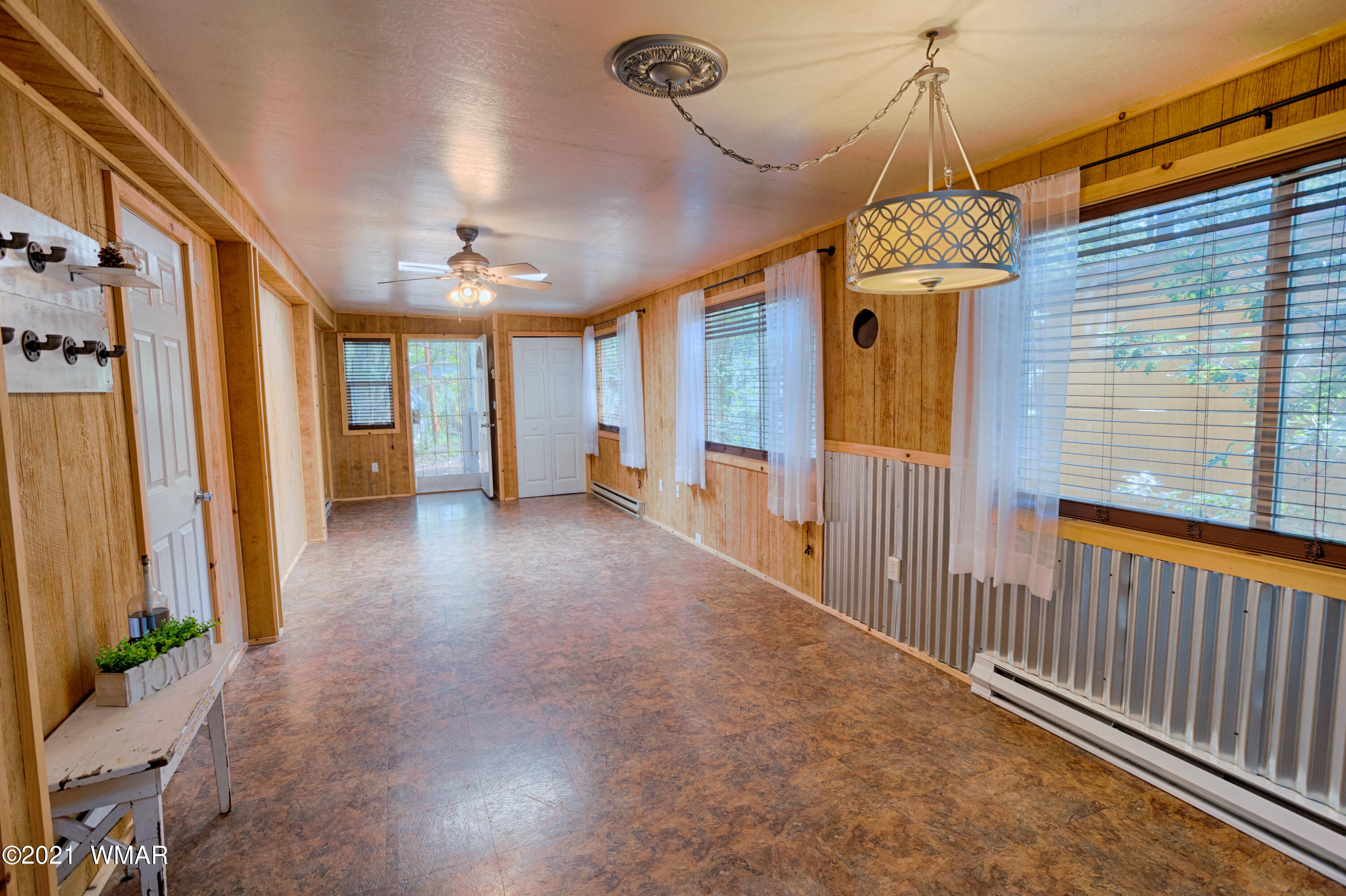 5232 South Blue Ridge Loop Pinetop, AZ 85935 - Photo 8 of 18 a view of a livingroom with a chandelier fan window and a chandelier