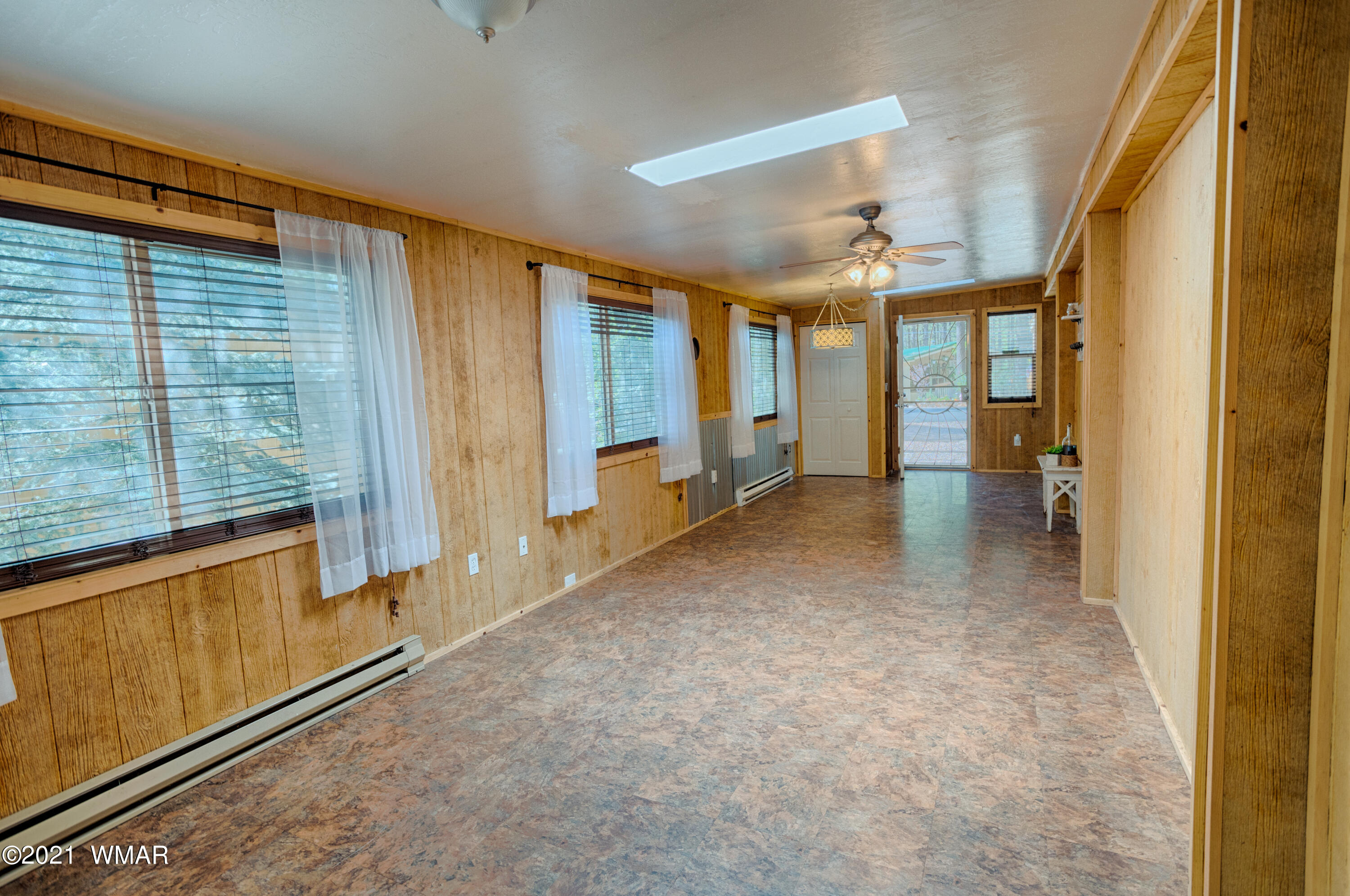 5232 South Blue Ridge Loop Pinetop, AZ 85935 - Photo 9 of 18 wooden floor in an empty room with a window