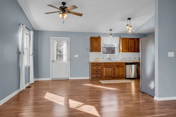 a kitchen with stainless steel appliances granite countertop a stove and a wooden cabinets