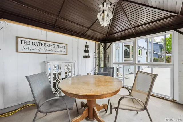 a view of a dining room with furniture window and outside view