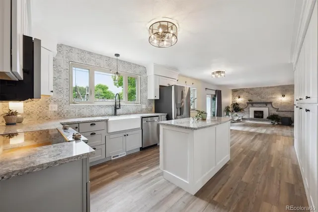 a kitchen with a sink and cabinets