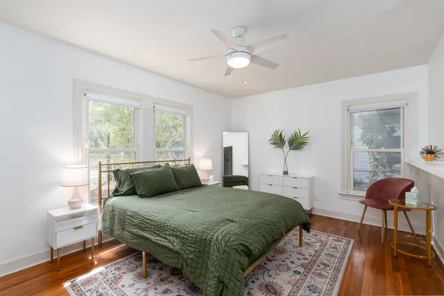 a bedroom with a bed and window