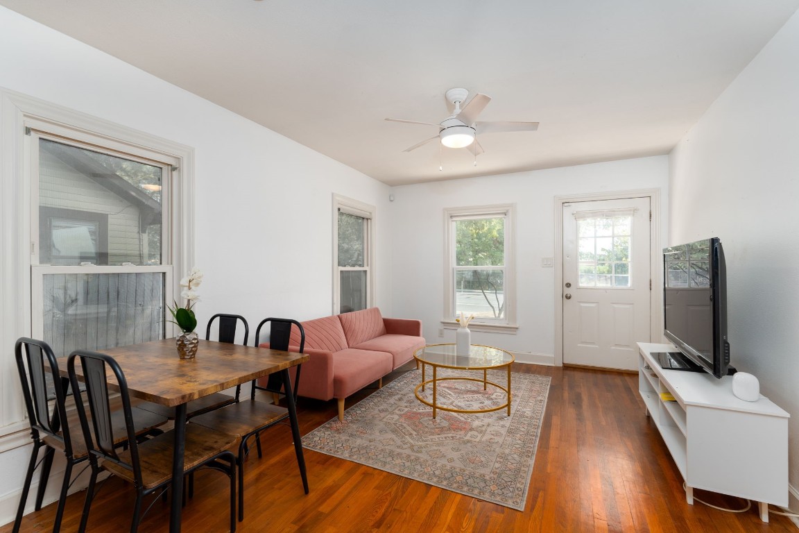 746 Springdale Road Austin, TX 78702 - Photo 7 of 19 a living room with furniture wooden floor and a flat screen tv