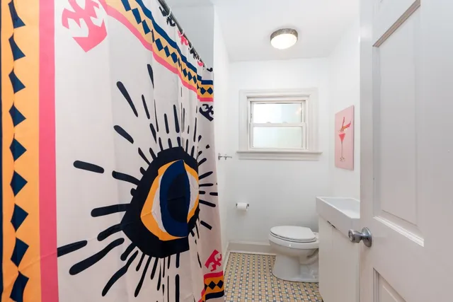 a bathroom with a bathtub and a toilet