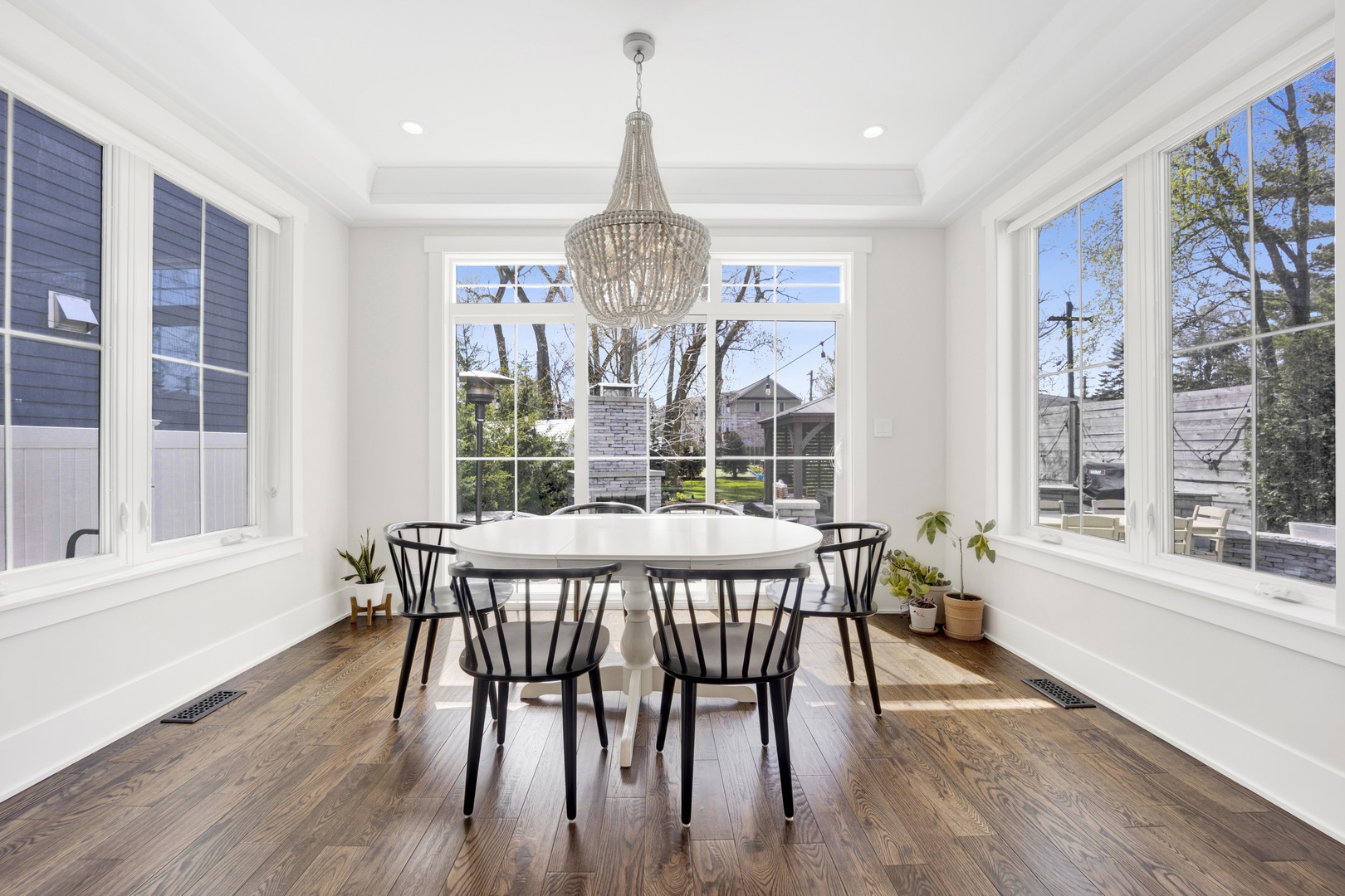 317 Lionel Road Riverside, IL 60546 - Photo 12 of 47 a view of a dining room with furniture wooden floor and chandelier