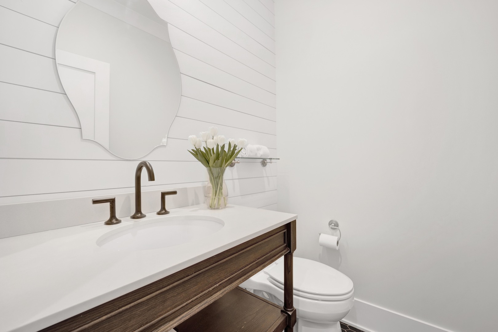 317 Lionel Road Riverside, IL 60546 - Photo 14 of 47 a bathroom with a sink a toilet and mirror