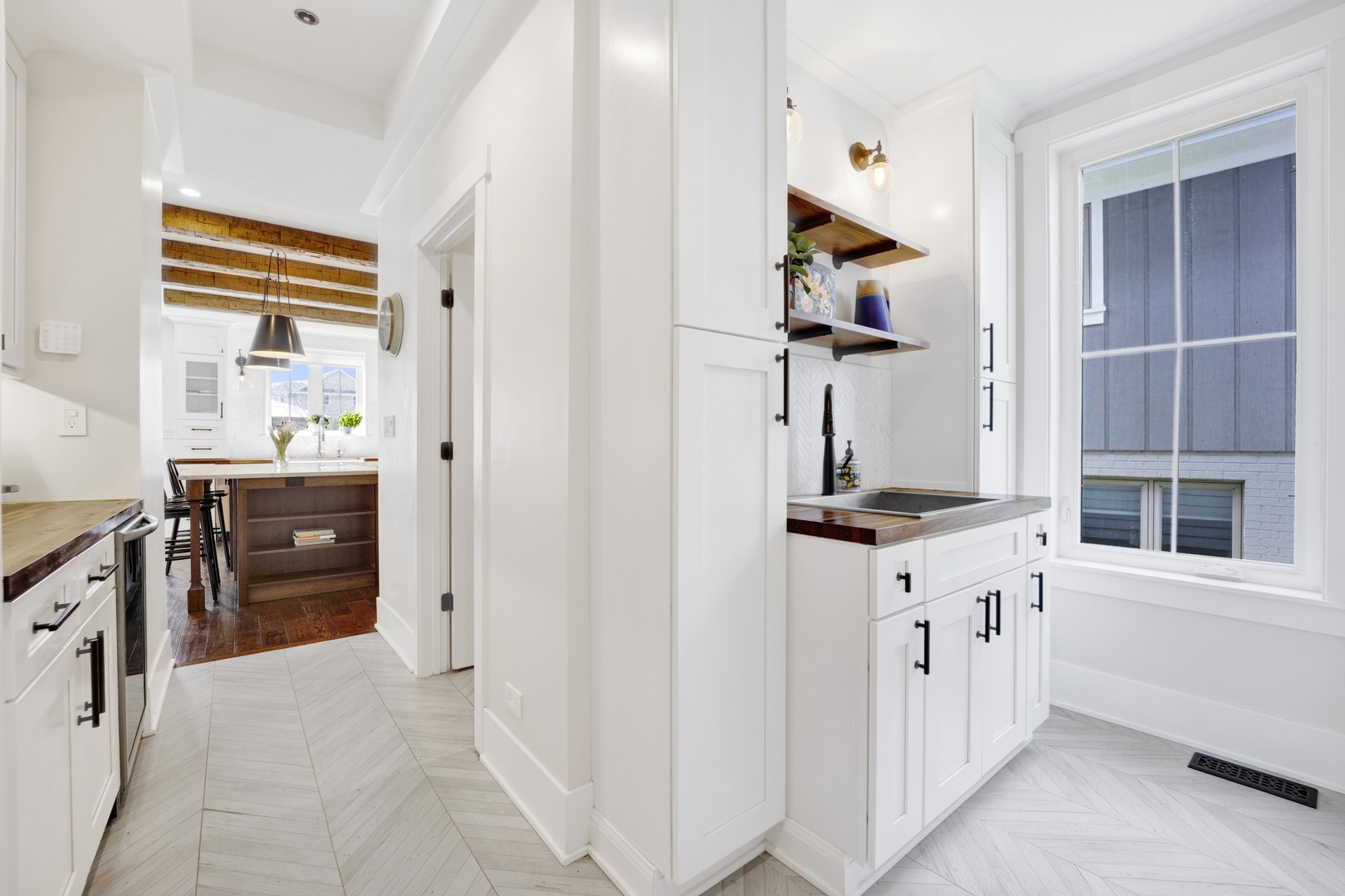 317 Lionel Road Riverside, IL 60546 - Photo 15 of 47 a hallway with sink and cabinets