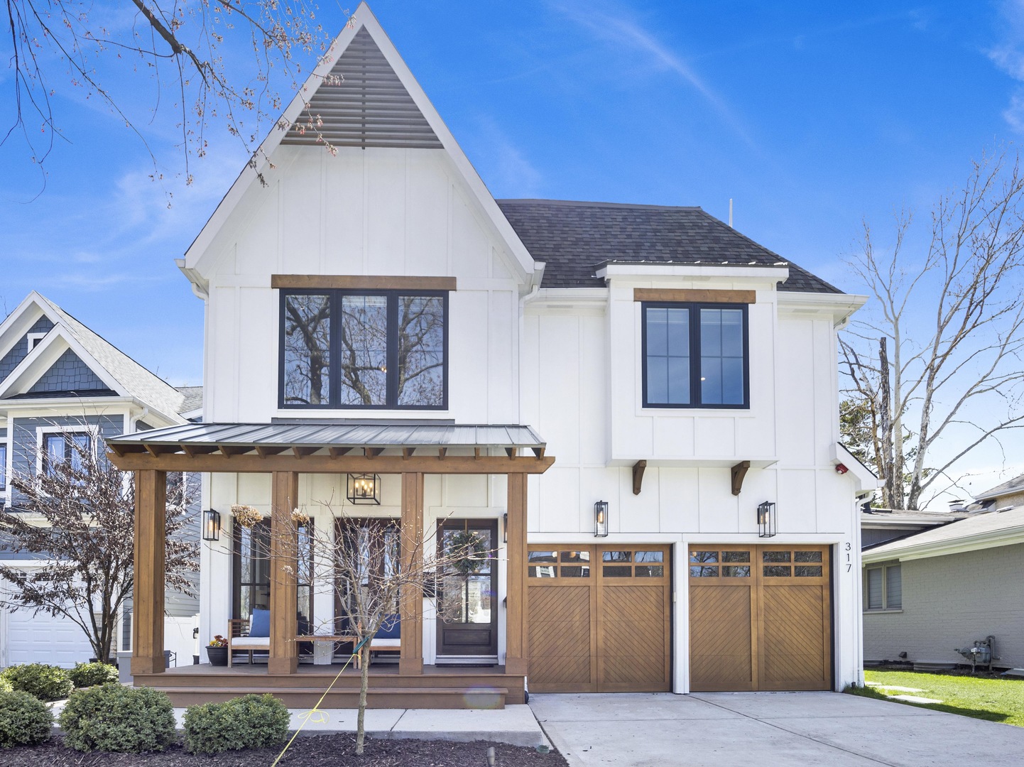 317 Lionel Road Riverside, IL 60546 - Photo 2 of 47 a front view of a house with lots of green space