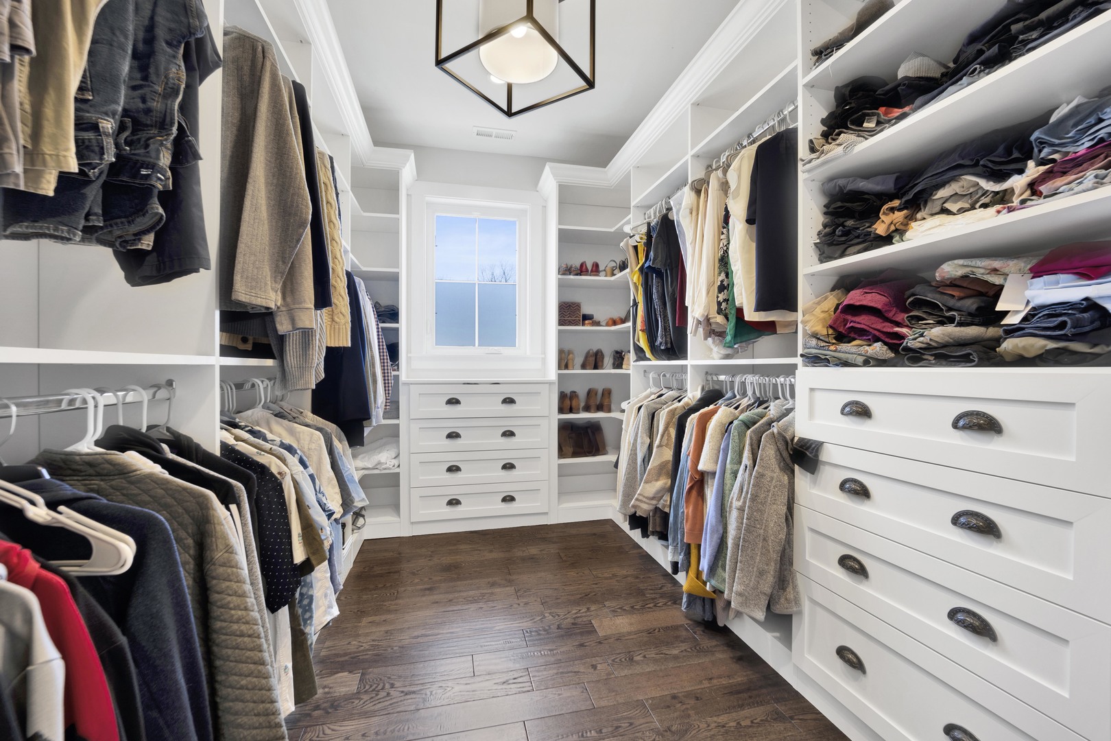 317 Lionel Road Riverside, IL 60546 - Photo 22 of 47 a view of walk in closet with clothes and shoes