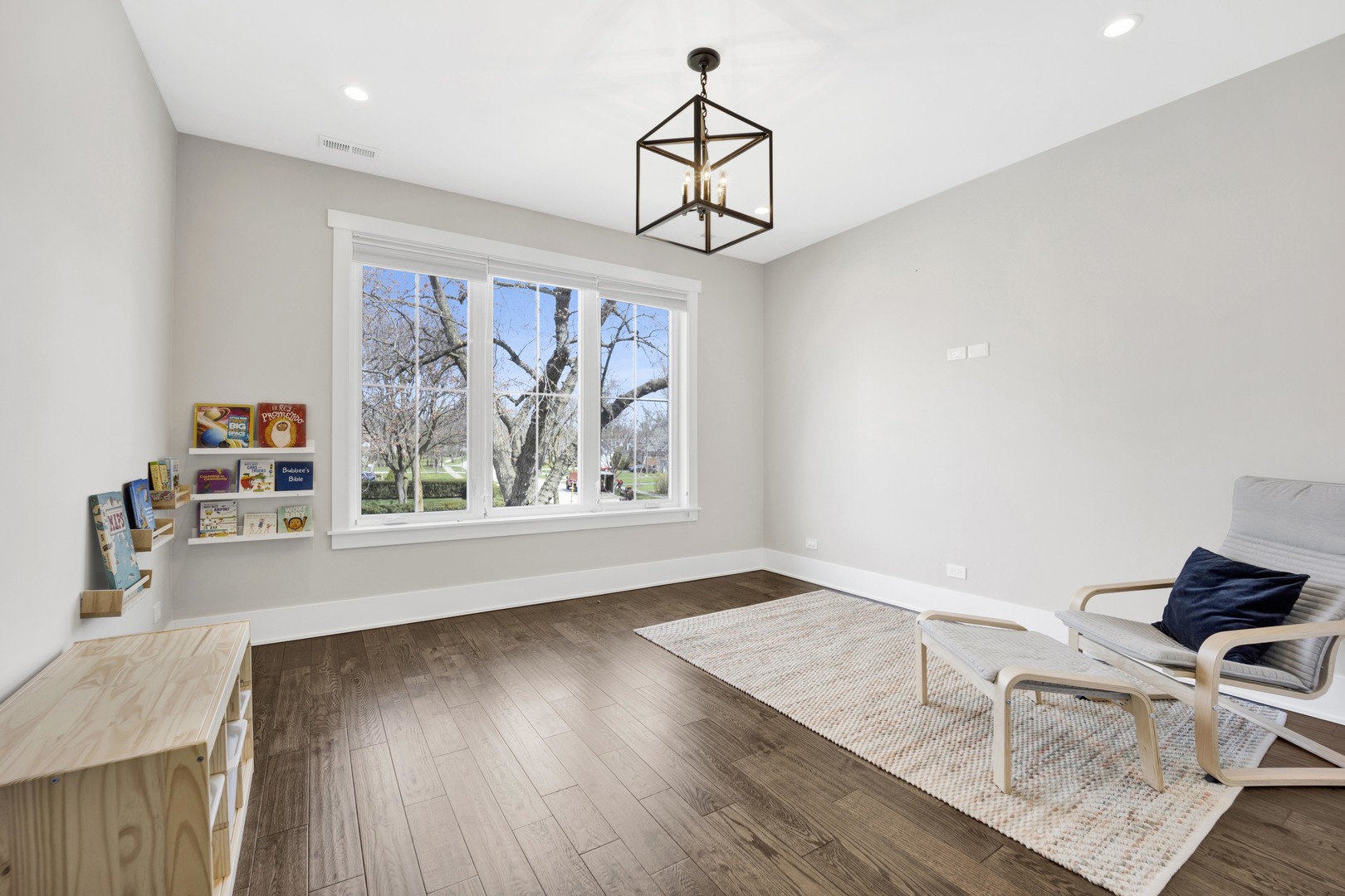 317 Lionel Road Riverside, IL 60546 - Photo 24 of 47 a view of room with window and wooden floor