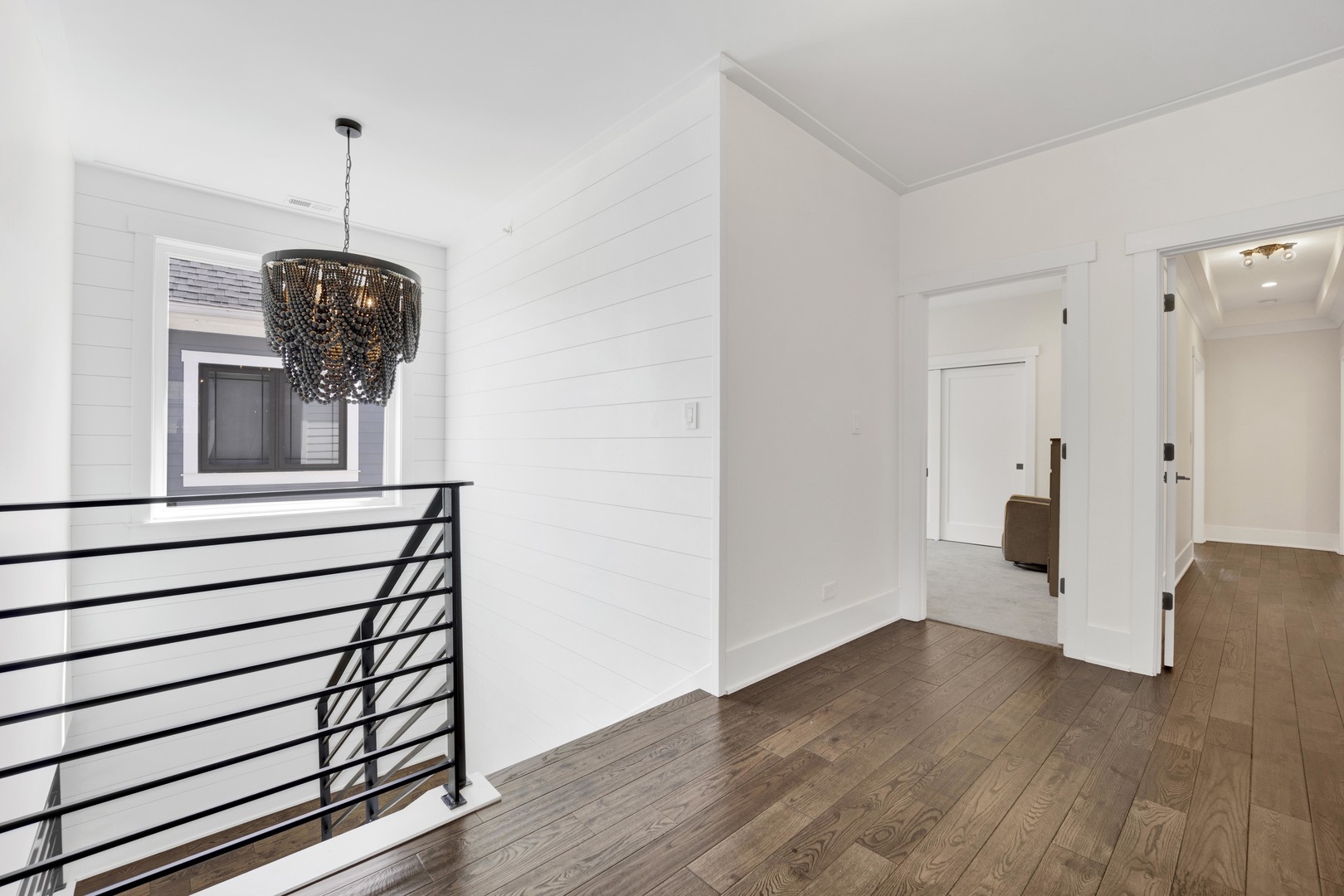 317 Lionel Road Riverside, IL 60546 - Photo 27 of 47 a view of a hallway with wooden floor and windows