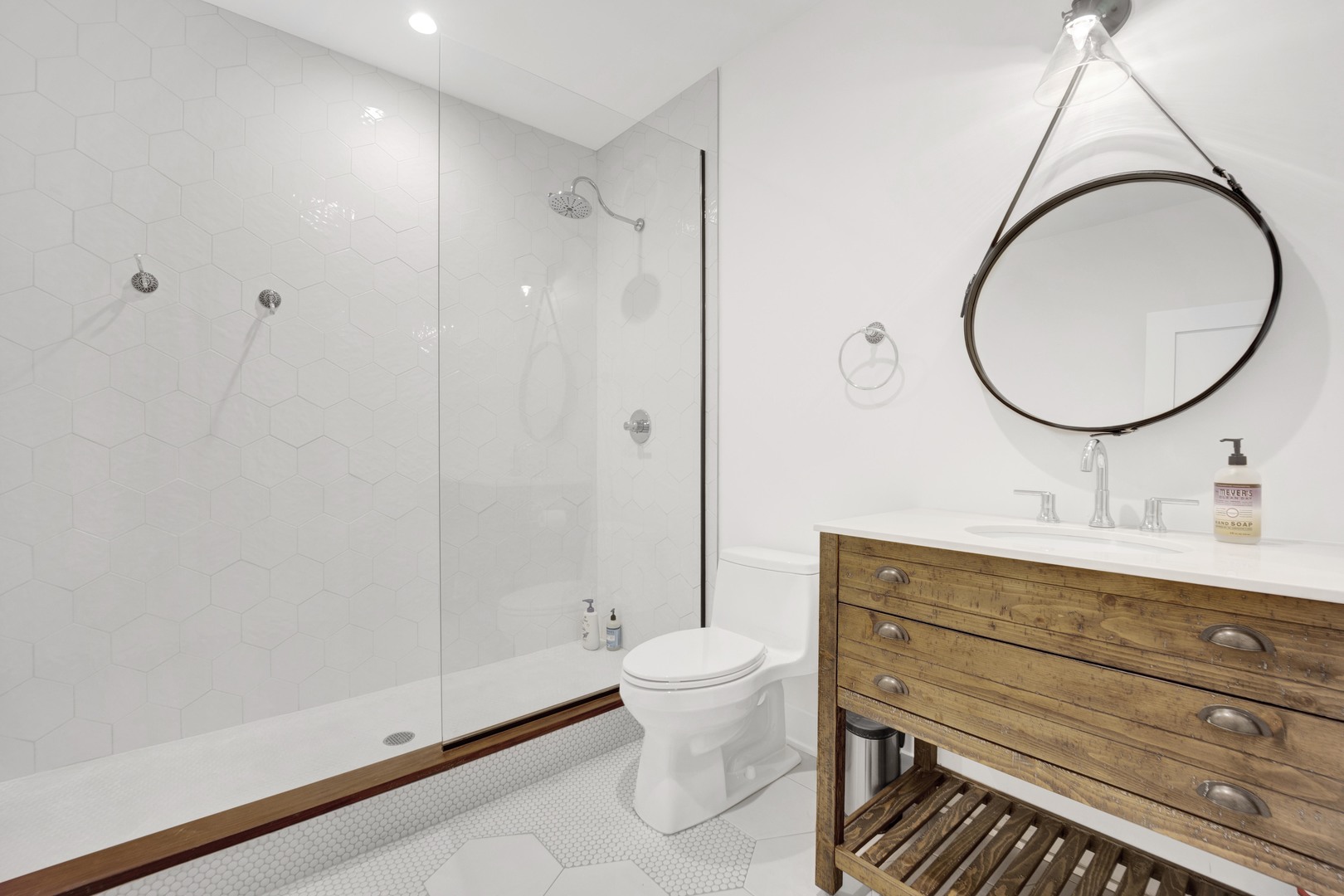 317 Lionel Road Riverside, IL 60546 - Photo 30 of 47 a bathroom with a granite countertop toilet a sink and a mirror