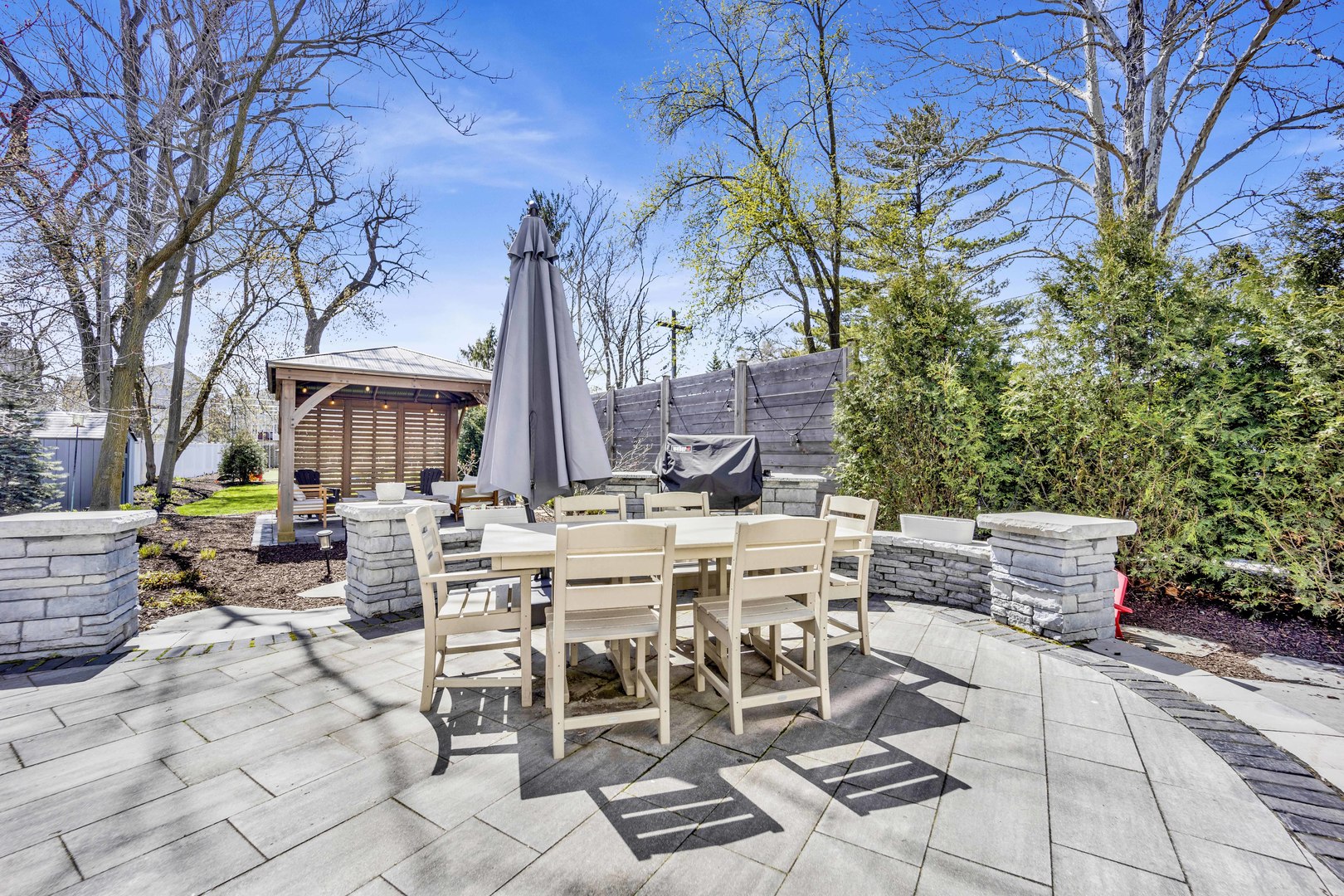 317 Lionel Road Riverside, IL 60546 - Photo 33 of 47 a view of a patio with table and chairs and potted plants