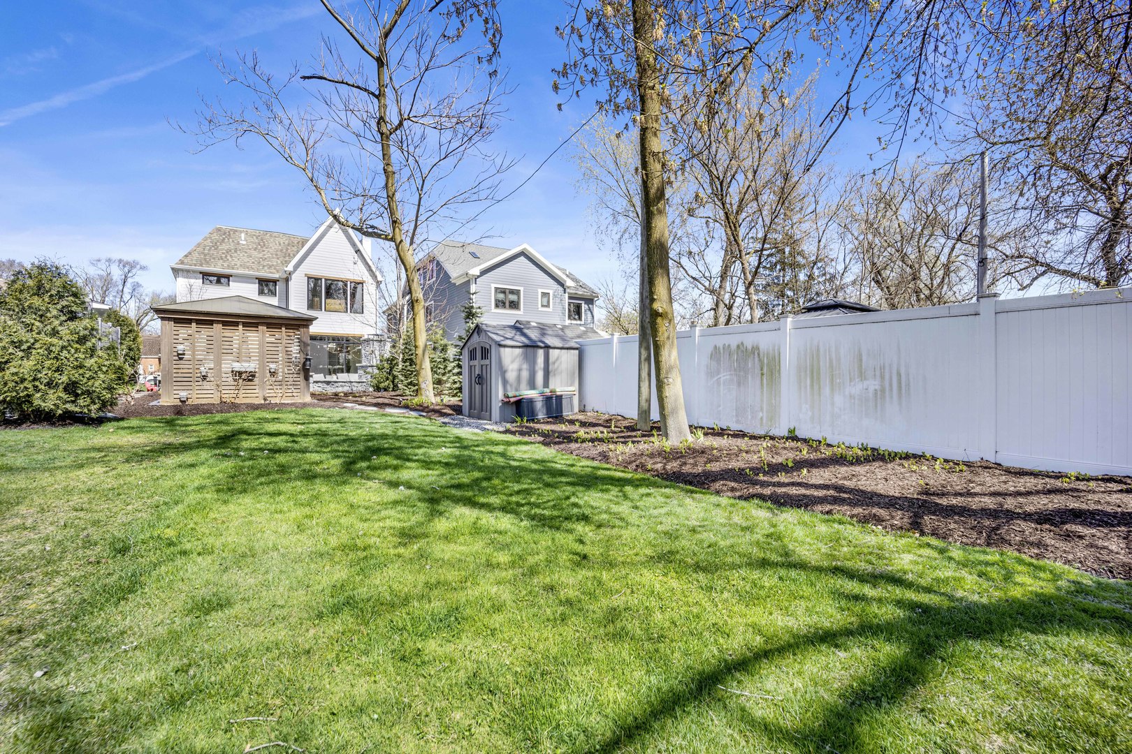 317 Lionel Road Riverside, IL 60546 - Photo 38 of 47 a view of a house with a big yard and large trees