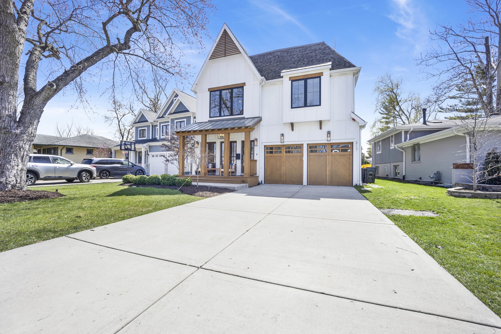 317 Lionel Road Riverside, IL 60546 - Photo 47 of 47 a front view of a house with a yard and potted plants