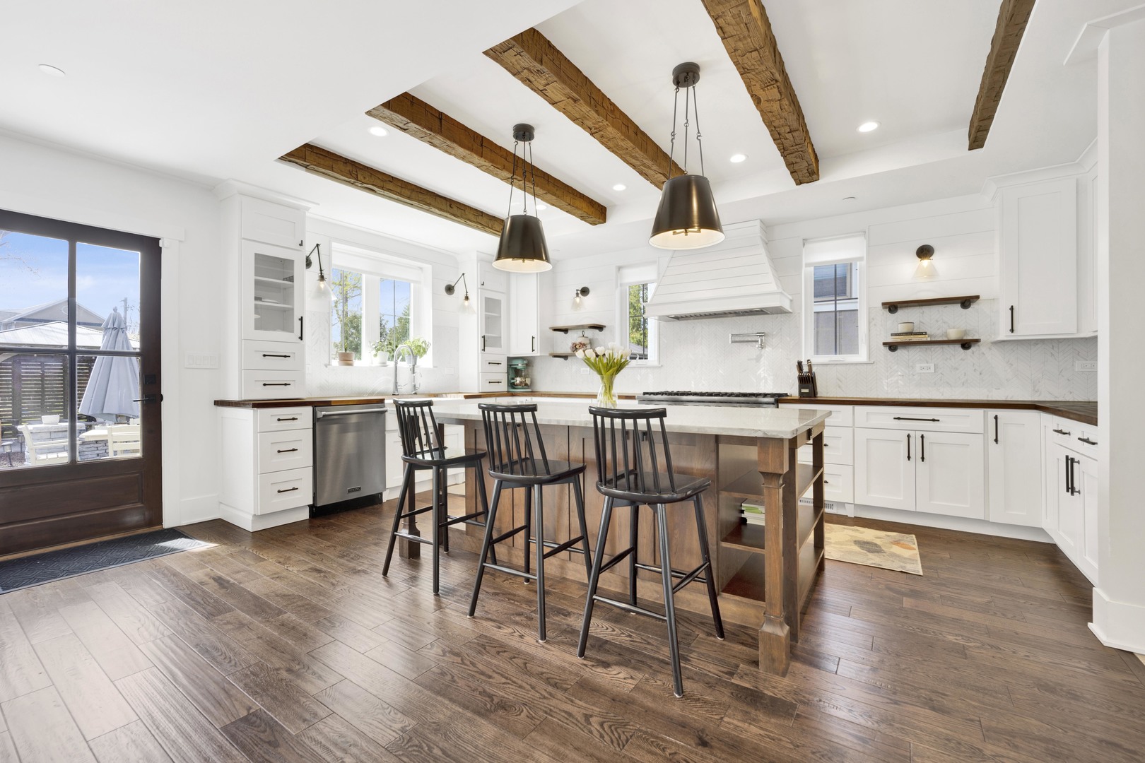 317 Lionel Road Riverside, IL 60546 - Photo 6 of 47 a kitchen with stainless steel appliances a dining table chairs and wooden floor