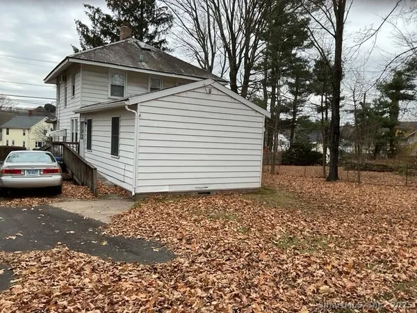 a view of a car park in front of house
