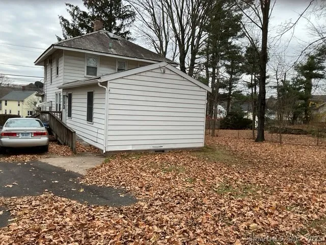 a view of a car park in front of house