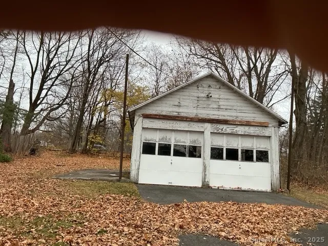 a house with trees in the background