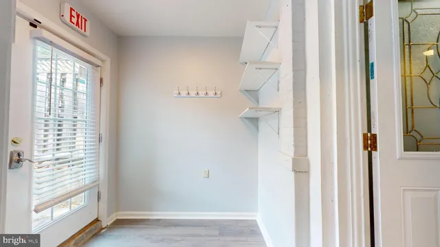 a view of a hallway with a window