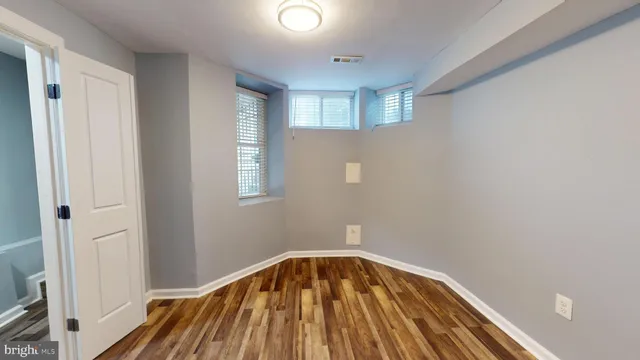 a view of a livingroom with wooden floor