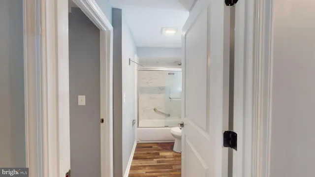 a bathroom with a glass shower door