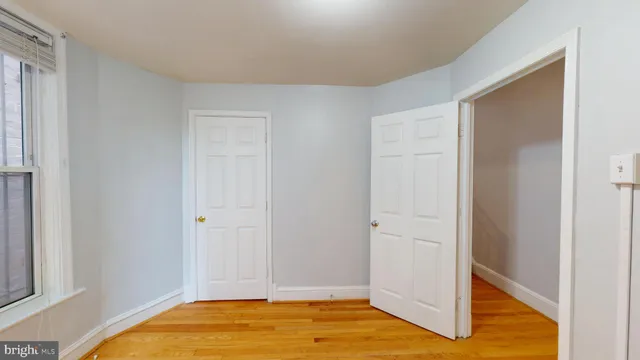 a view of room with wooden floor