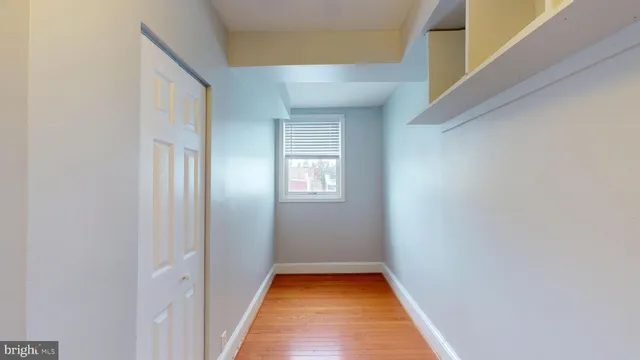 a view of hallway with a white walls
