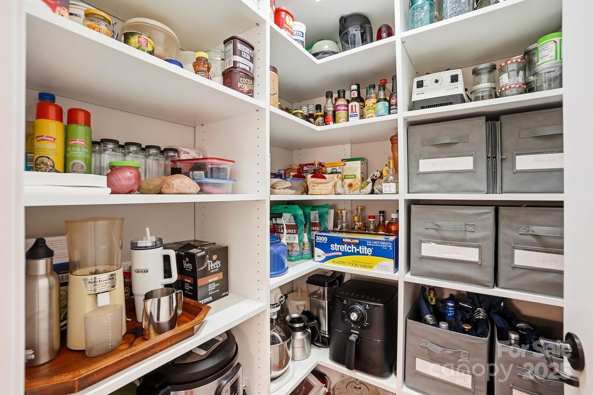 4069 Henshaw Road Waxhaw, NC 28173 - Photo 17 of 48 a walk in closet with clothes and shoes