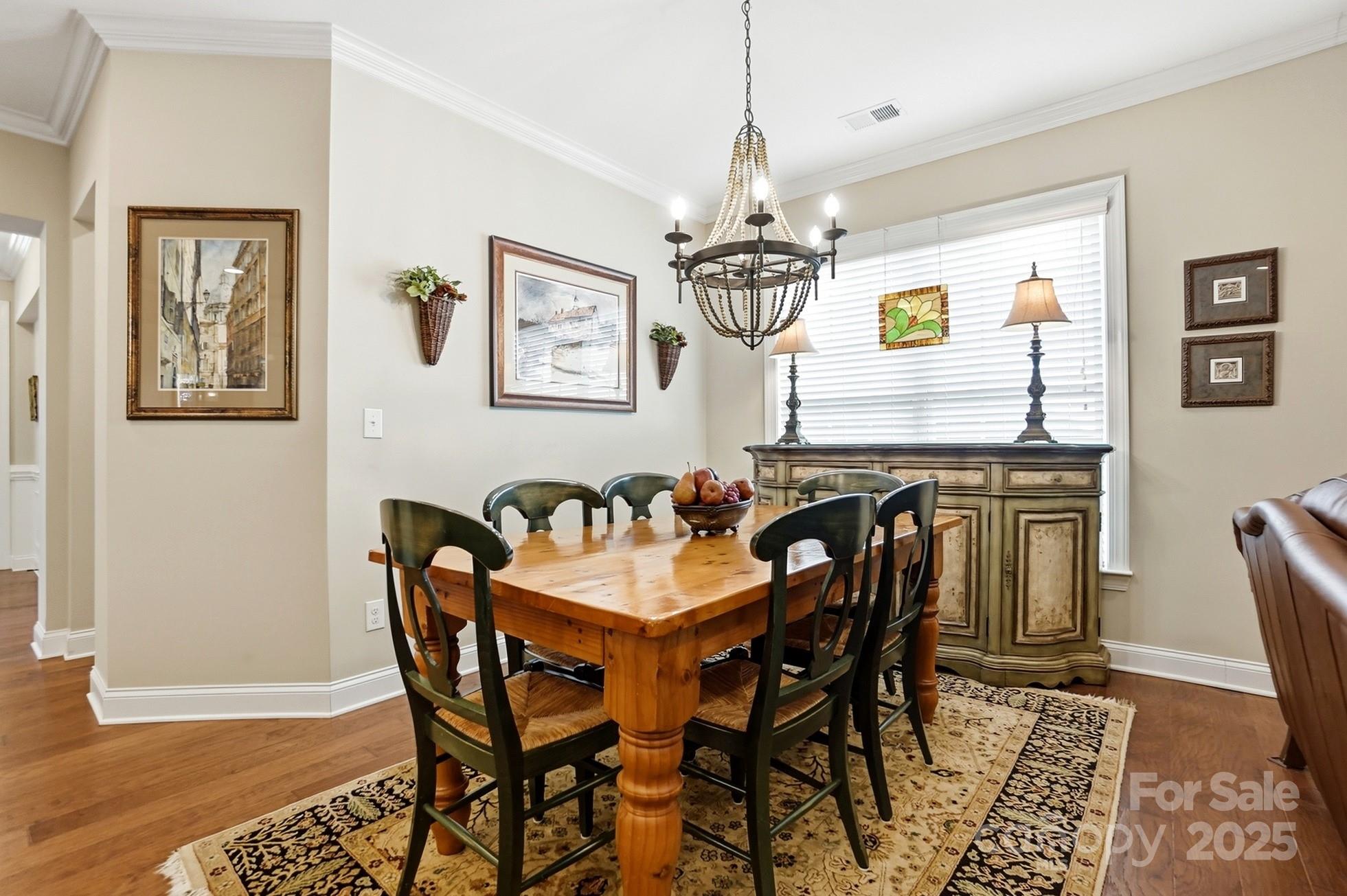 4069 Henshaw Road Waxhaw, NC 28173 - Photo 19 of 48 a view of a dining room with furniture and chandelier