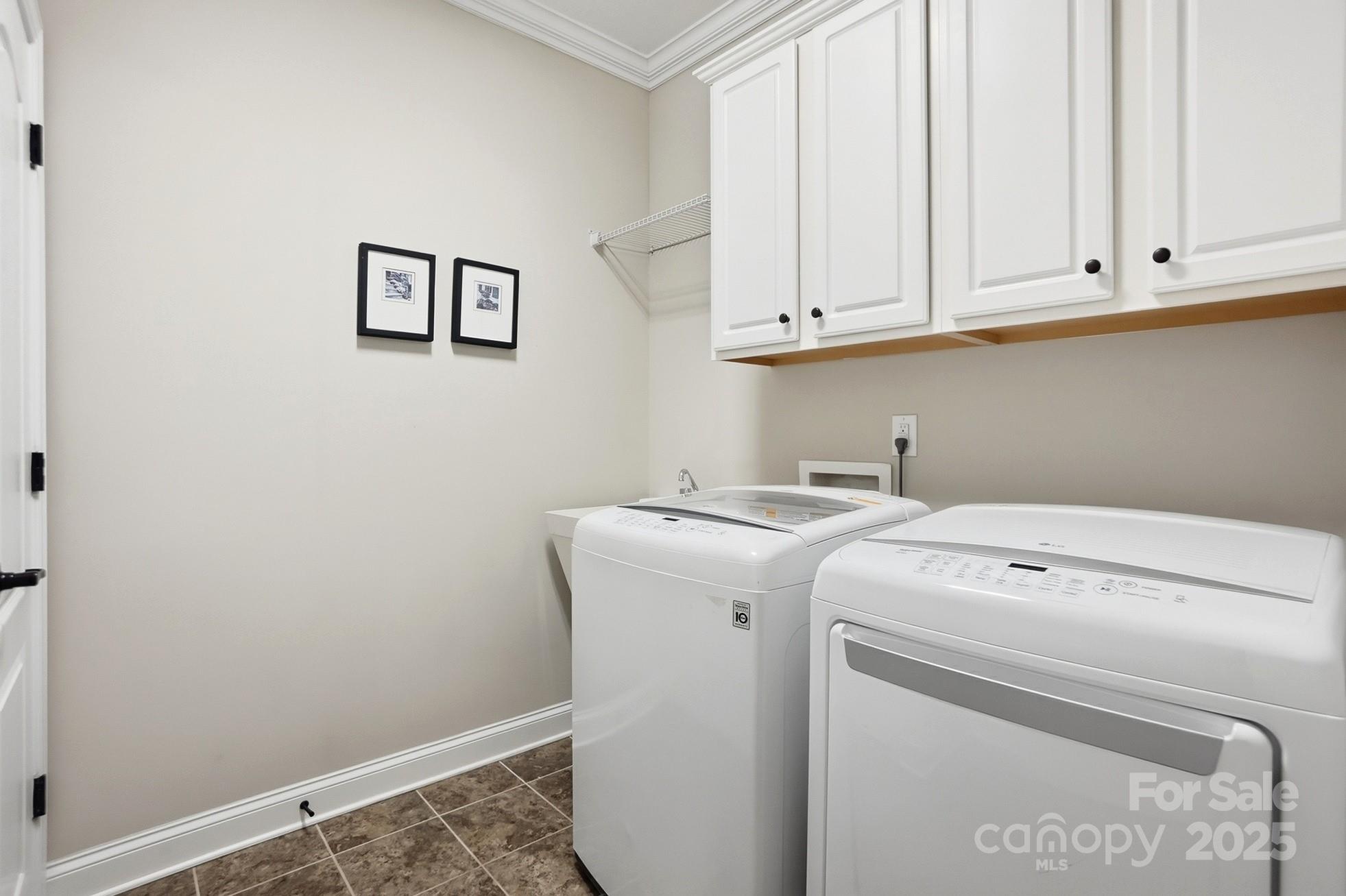 4069 Henshaw Road Waxhaw, NC 28173 - Photo 21 of 48 a utility room with dryer and washer