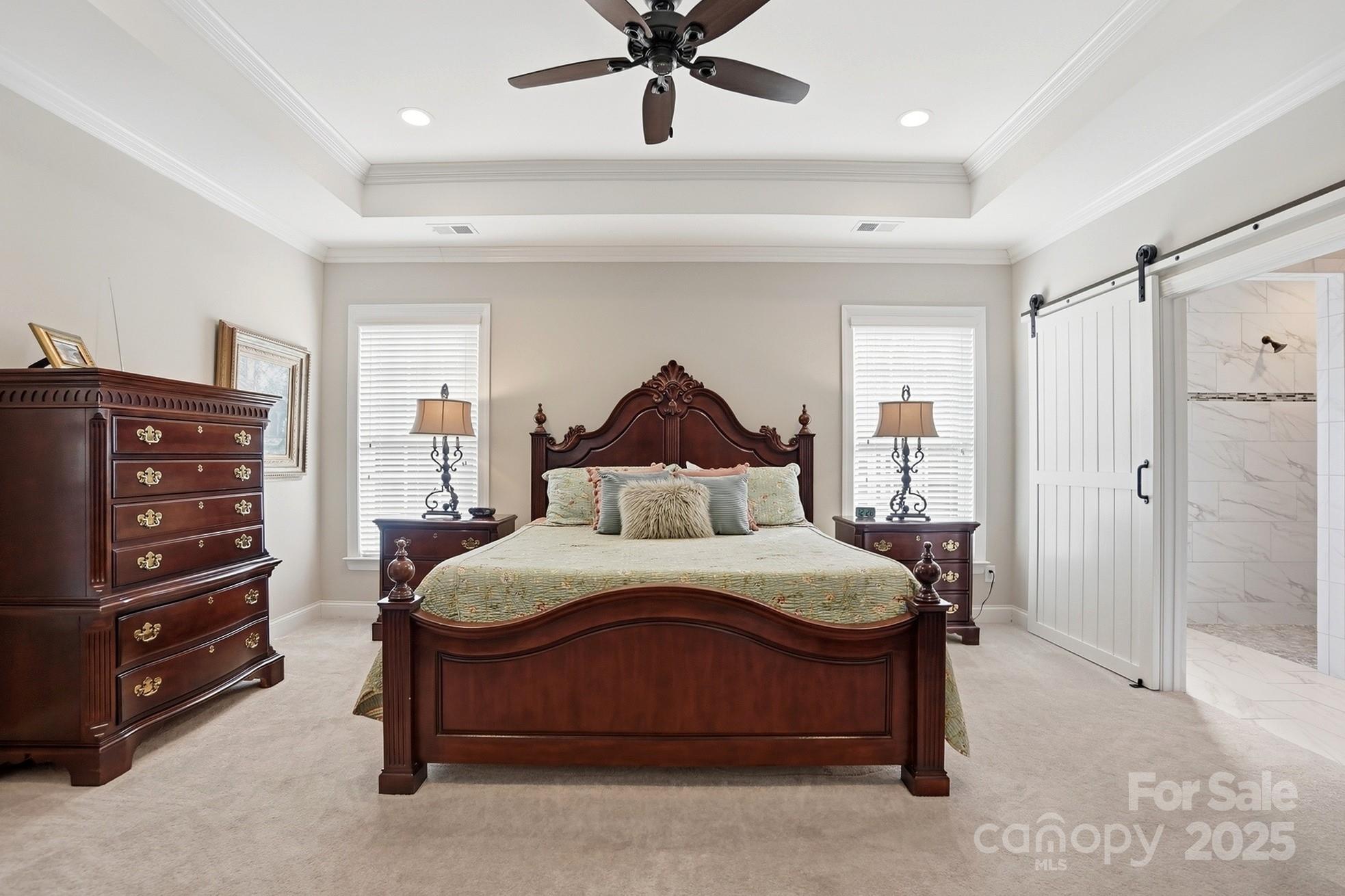 4069 Henshaw Road Waxhaw, NC 28173 - Photo 22 of 48 a bedroom with a bed and a ceiling fan