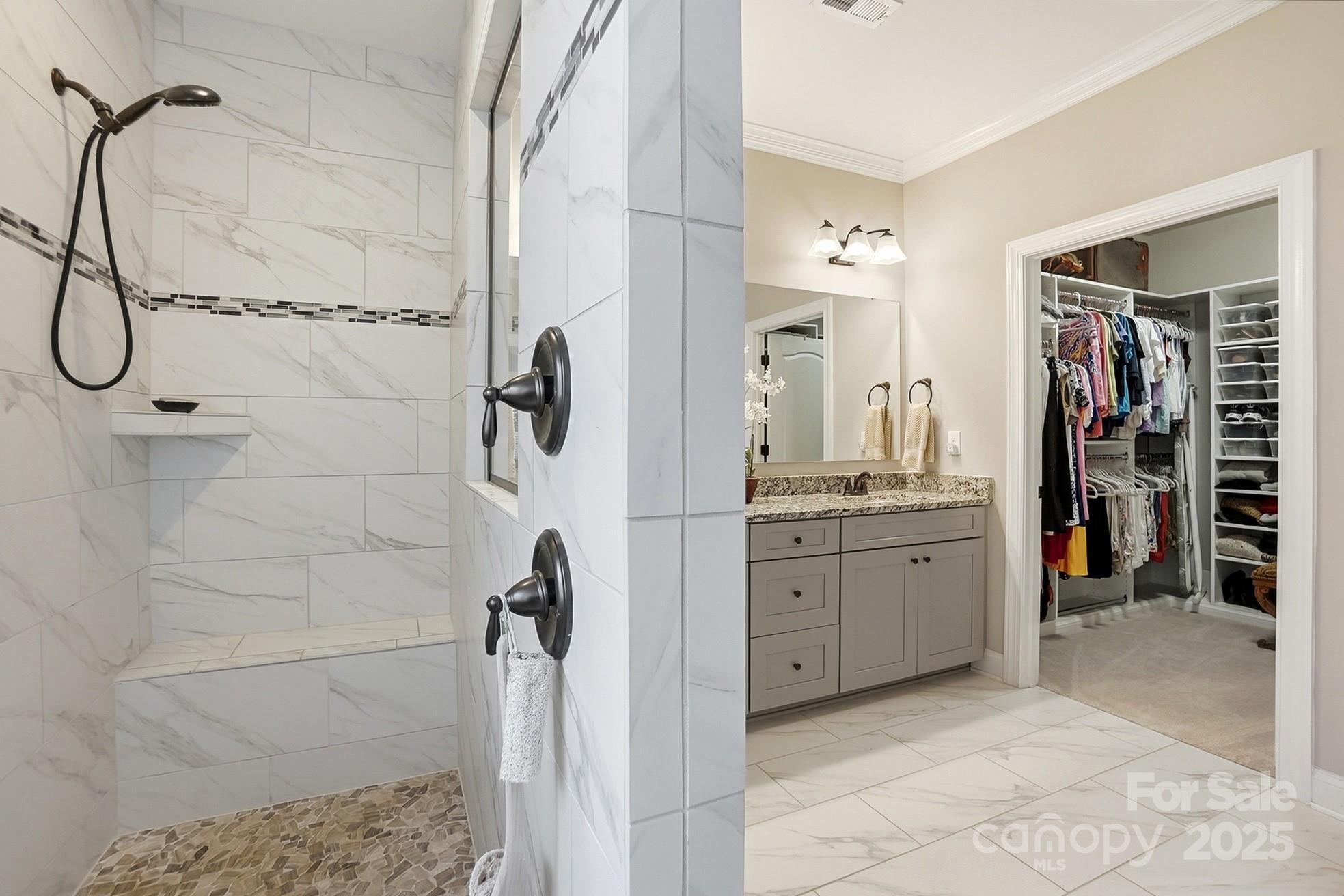 4069 Henshaw Road Waxhaw, NC 28173 - Photo 25 of 48 a bathroom with a granite countertop shower a sink and a mirror