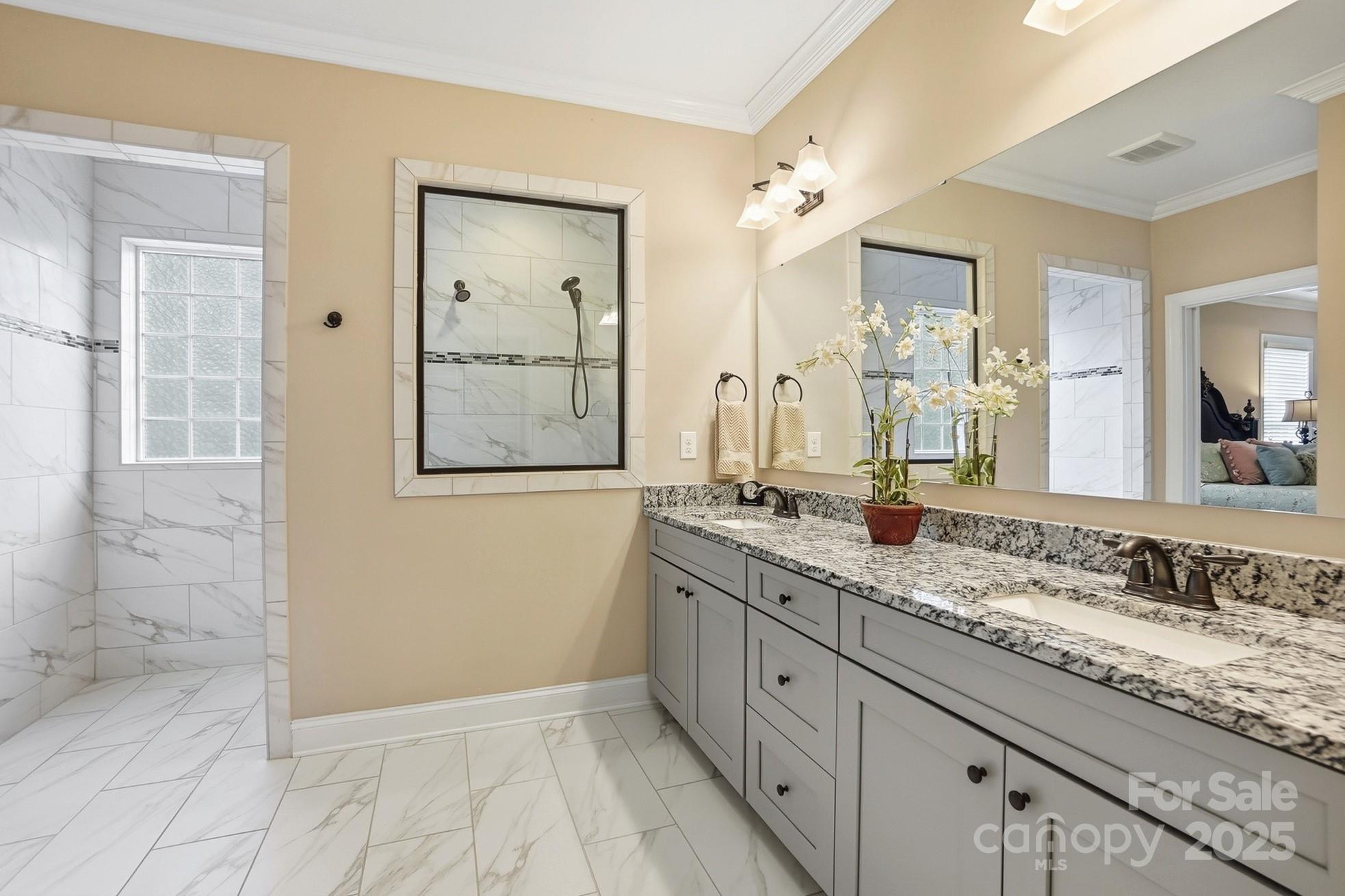 4069 Henshaw Road Waxhaw, NC 28173 - Photo 28 of 48 a bathroom with a granite countertop sink mirror and double