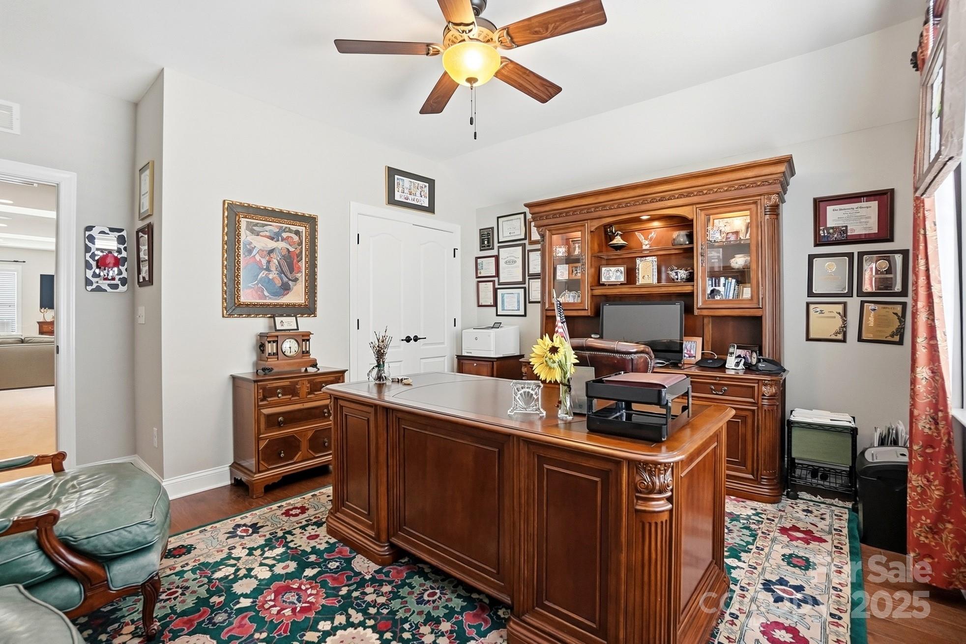 4069 Henshaw Road Waxhaw, NC 28173 - Photo 38 of 48 a room with furniture a rug and a chandelier