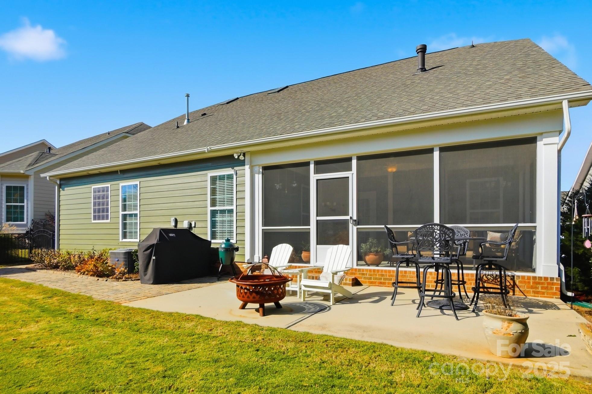 4069 Henshaw Road Waxhaw, NC 28173 - Photo 44 of 48 a backyard of a house with outdoor seating