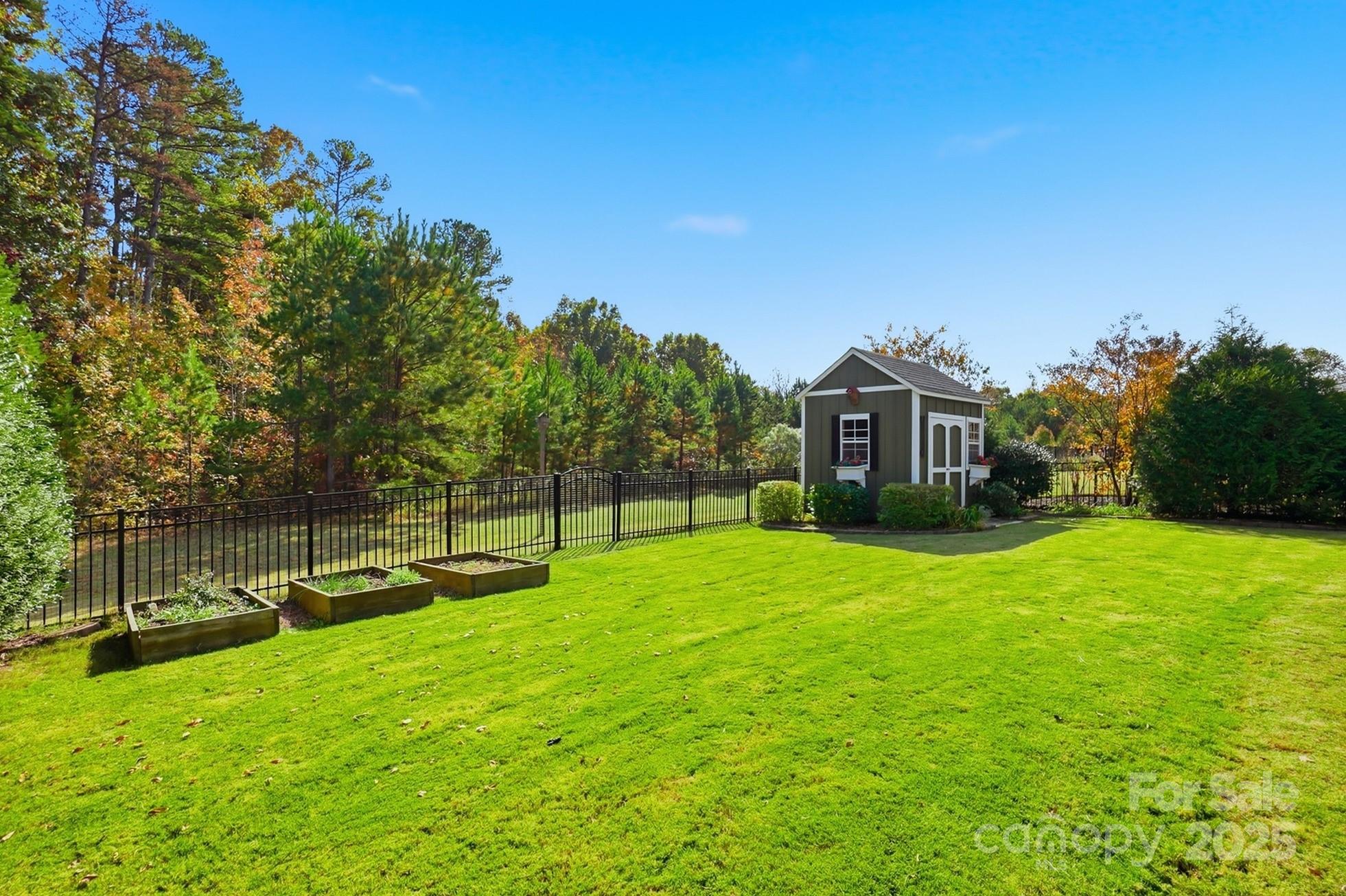 4069 Henshaw Road Waxhaw, NC 28173 - Photo 46 of 48 a view of a house with backyard and sitting area