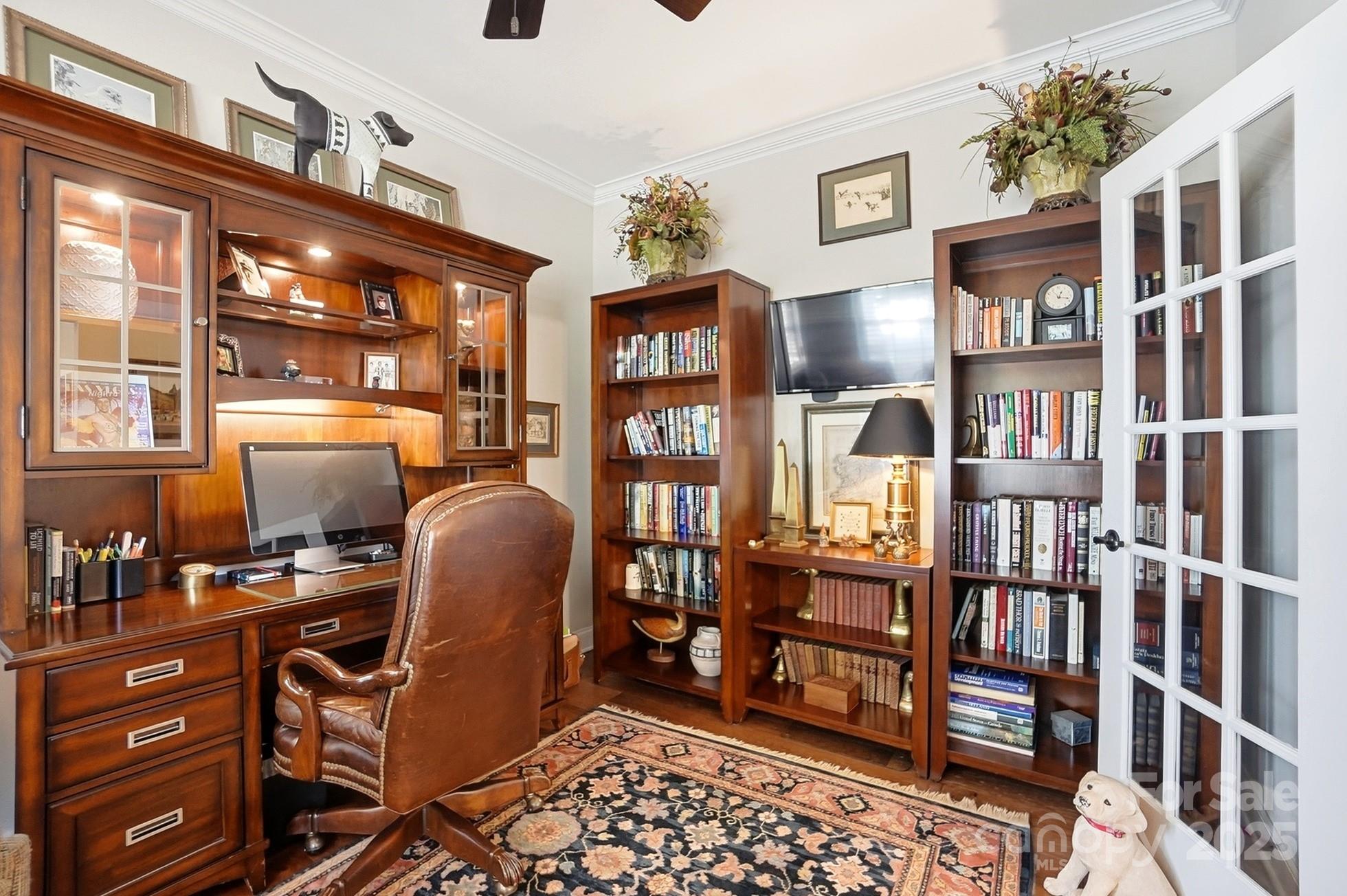 4069 Henshaw Road Waxhaw, NC 28173 - Photo 7 of 48 a work room with furniture cabinets and book shelf