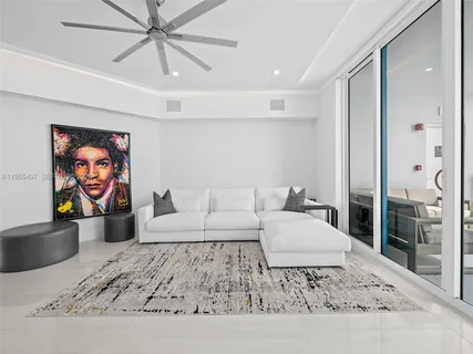 a kitchen with white cabinets and dining table chair