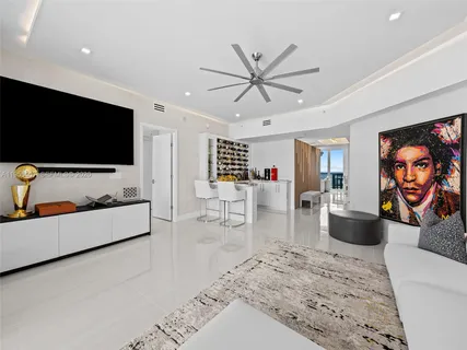 a bedroom with a large bed and a couch