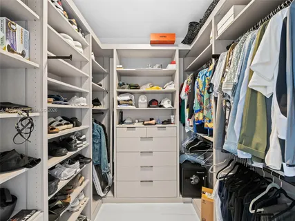 a view of a living room with furniture wooden floor and chandelier