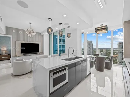 a kitchen with a table and chairs