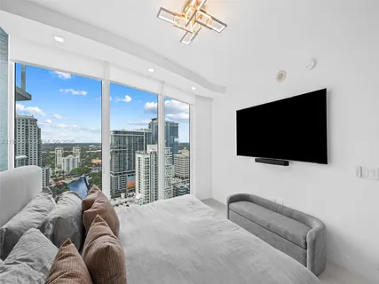 a view of a patio with couches table and chairs and potted plants