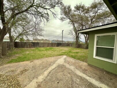 4214 37th Street Lubbock, TX 79413 - Photo 14 of 14 a view of a house with backyard and a tree