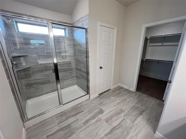 a view of a bathroom with a glass door